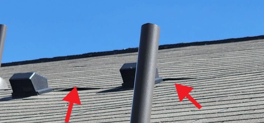 Roof shingle uplift noted during an inspection