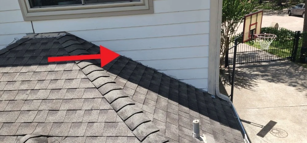 Roof and siding separation showing a moisture concern
